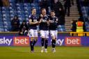 Jed Wallace, Charlie Cresswell and Danny McNamara celebrate Cresswell's goal against Swansea