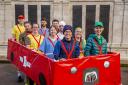Jackie Scully, 42, (front left) from Greenwich, south London, who is aiming to break a Guinness World Record for the fastest time in a 10-person costume at this year's TCS London Marathon.