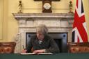 Theresa May signs the letter that will lead to Britain leaving the EU