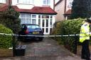 The scene in Ernest Grove this morning, where blood can be seen smeared on the door of the house