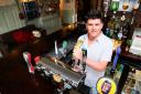 Stuart Antony, who played Simon White in EastEnders, pulling a pint in new his pub