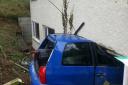 The car wedged under part of the house in Darenth Hill.