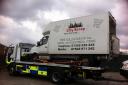 Police seize a City Scrap lorry.