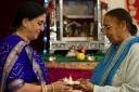 Celebration: Prafulla Ravell and Jaswant Lamba light candles to celebrate Diwali at Anand day centre on Wednesday