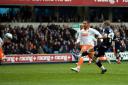 Andy Keogh fires Millwall into the lead. PICTURES BY EDMUND BOYDEN.
