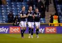 Jed Wallace, Charlie Cresswell and Danny McNamara celebrate Cresswell's goal against Swansea