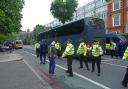 Three charged after south east London protest stops coach with asylum seekers