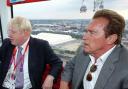 Arnold Schwarzenegger takes a ride over the Thames with London Mayor Boris Johnson