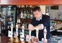 News Shopper's Andrew Parkes gets behind the bar at The George and Dragon in Swanscombe