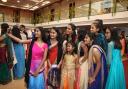 Girls take a group selfie at Woolwich's Hindu temple's Diwali festival