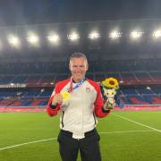 Adam Day, Bexley boy and football coach pictured with his Olympic gold medal in Tokyo