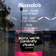 A sign on the doors of a branch of Nando's in White City, Manchester.  Peter Byrne/PA Wire