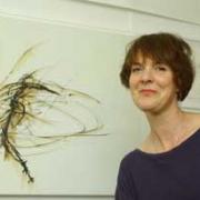 Sally McKay with one of her drawings at the open studios event in Woolwich
