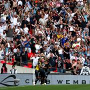 Bromley's Michael Cheek celebrates with his team-mates after scoring their side's first goal of the game during the Buildbase FA Trophy final at Wembley Stadium, London