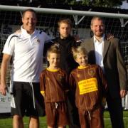 Mark Hammond (centre) with Joe Francis (left) Ian Jenkins (right) and two young supporters