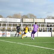 Cray Wanderers Yahaya Bamba takes on Hornchurch's Remi Sutton in the second half.