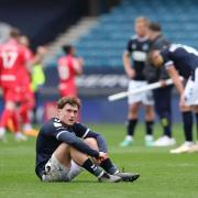 Millwall’s Callum Styles sits dejected after the loss to Blackburn