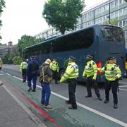 Three charged after south east London protest stops coach with asylum seekers