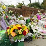 Flowers left at the scene where Sally Hodkin was stabbed