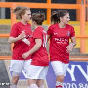 Sinead Boyer celebrates with Kit Graham and Harley Bennett after opening the scoring against Barnet. Picture by T Siegfried Ip.