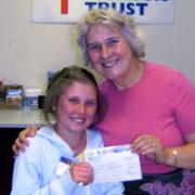 Georgia Beazley presents the cheque to Rosie Barnes