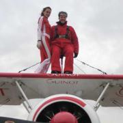 Dan is strapped in by wing-walker Sarah Tanner.