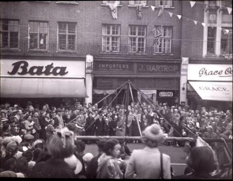 Maypole dancing in Beckenham High Street for coronation June 2 1953