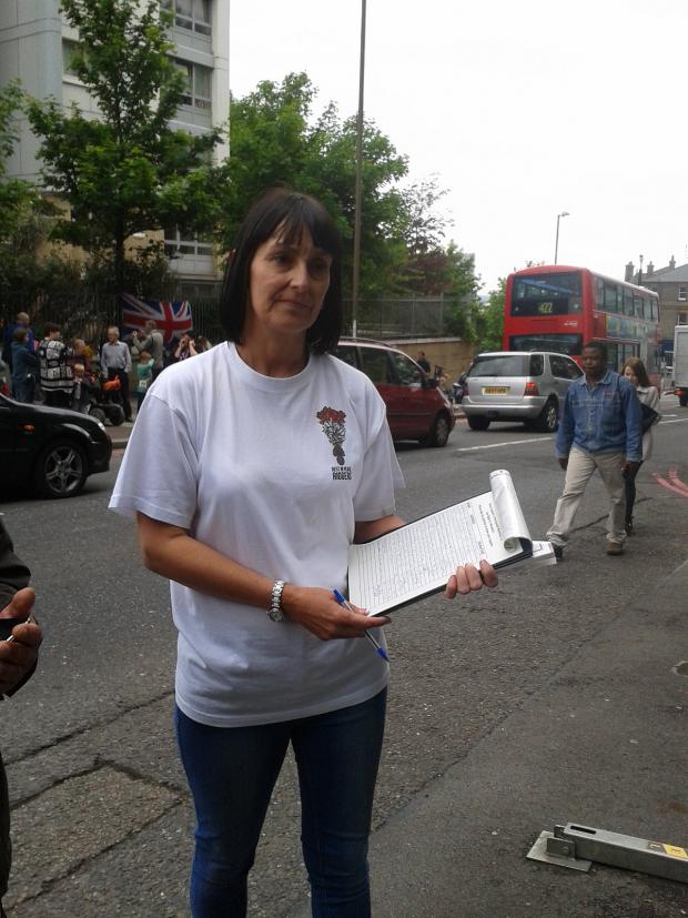News Shopper: Lorna Taylor holding her petition for a permanent memorial to Lee Rigby in Woolwich