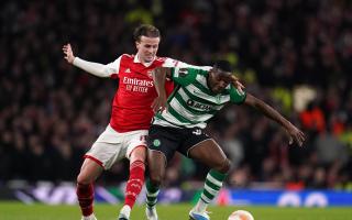 Arsenal's Rob Holding (left) and Sporting Lisbon's Dario Essugo battle for the ball at the Emirates