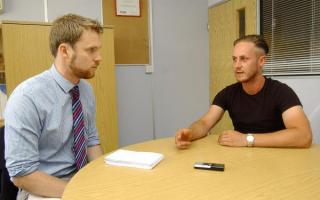 Tom Fuller (right) giving his story to News Shopper in August