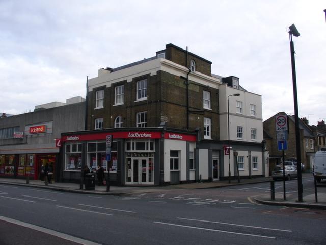 The British Queen was situated at 208 Woolwich Road, SE10. This pub was latterly known as The Greenwich Village and Ricks. Closed in 2011 it is now in use as a bookmakers. Picture: closedpubs.co.uk & Ian Chapman
