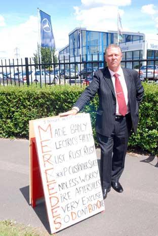 Chris Pavey has been protesting outside the Mercedes Benz garage every day for four weeks.