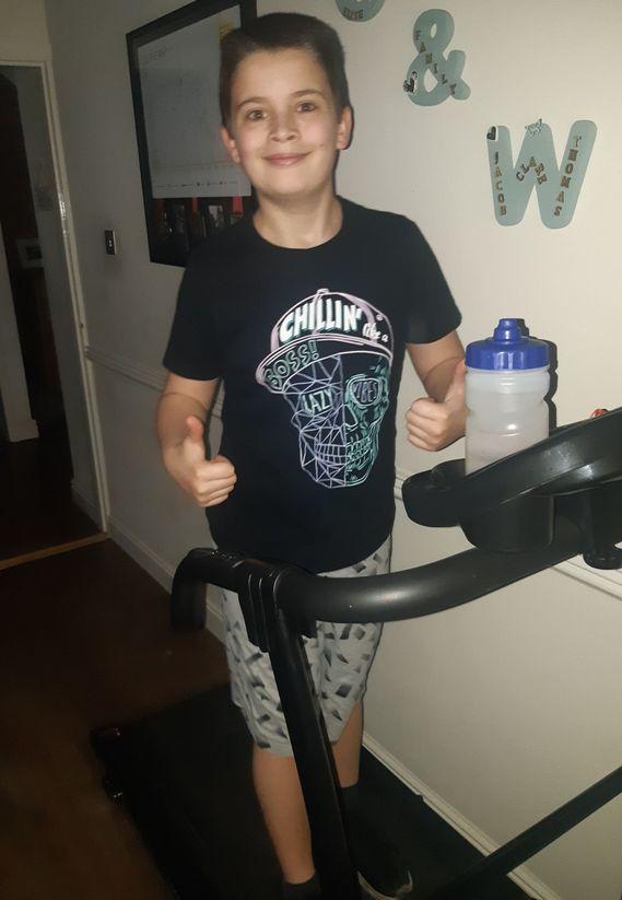 Thomas completing his half marathon on the treadmill in 2020
