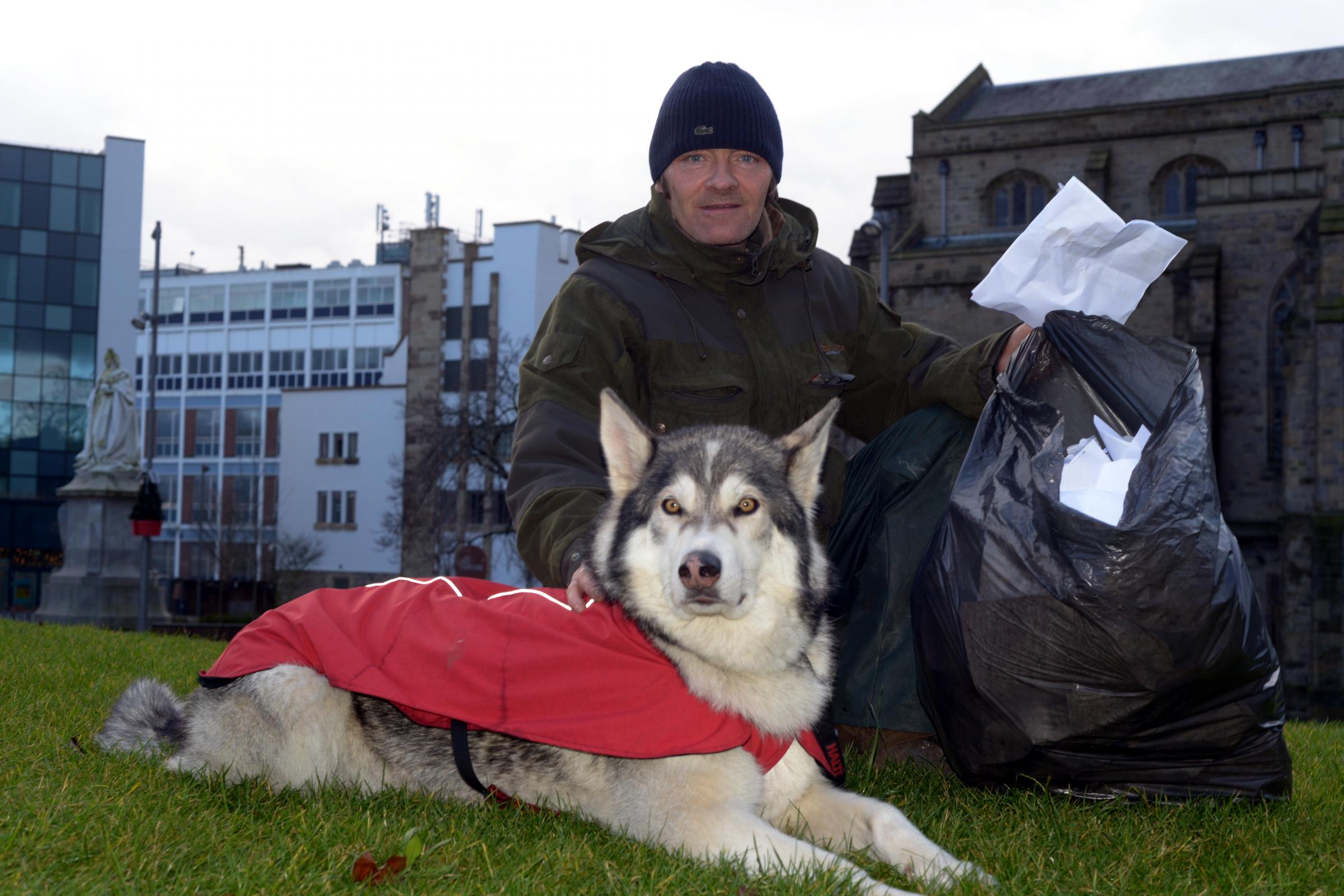 LITTER PICKER: Wayne Dixon, and his dog, Koda from Witton, Blackburn, are litter picking their way around Great Britain.
