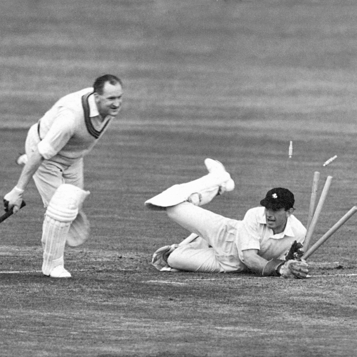 Kent Wicket Keeper Derek Ufton dives through the wicket and sends the bails flying, but his only reward is a grin from Somersets Australian born batsman William Alley, who gets to the crease in time - but only just. Alley was batting in Somersets