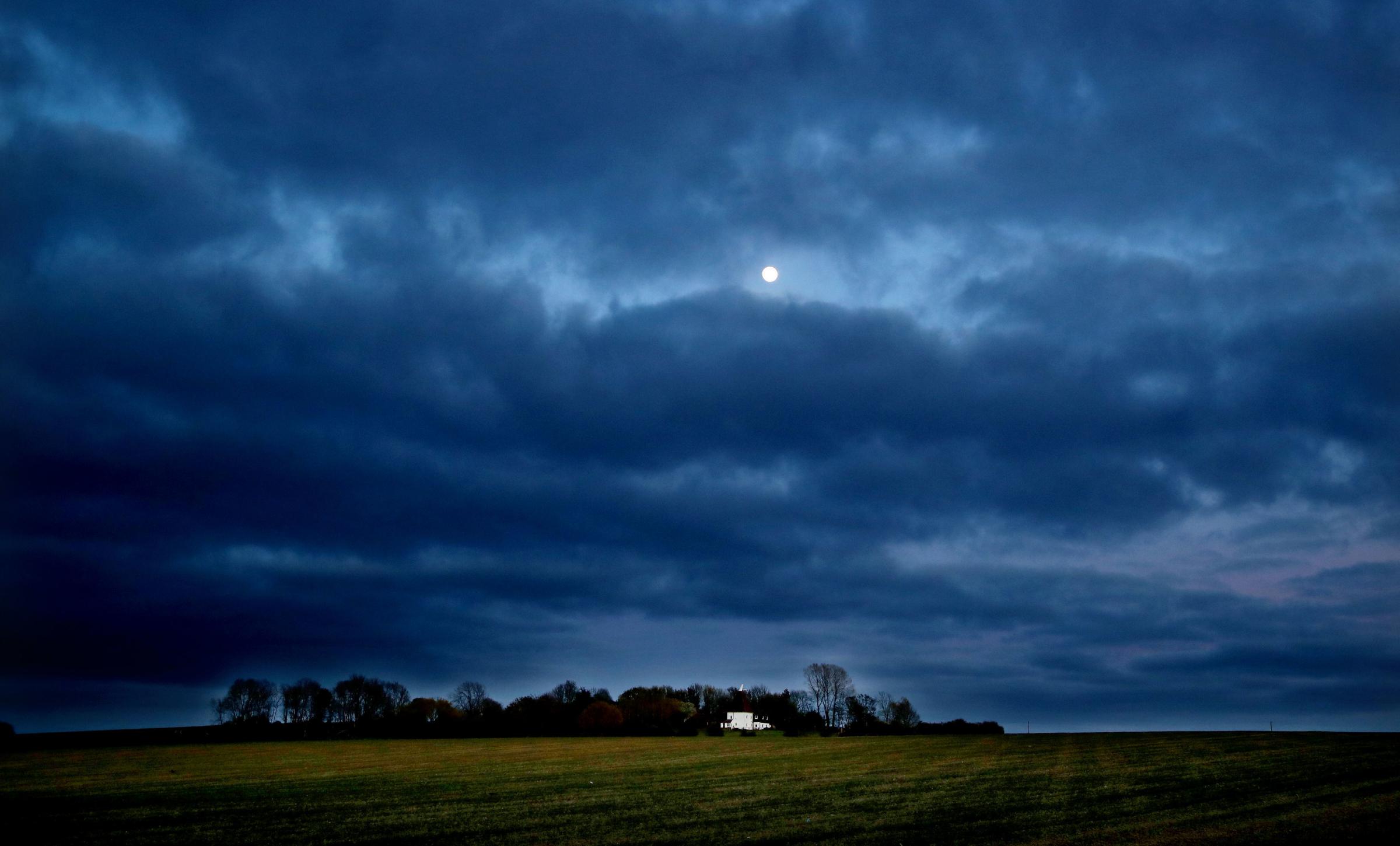 The moon in the skies over Ashford in Kent, the day before it reaches its fullest and becomes a Supermoon. Gareth Fuller/PA Wire 
