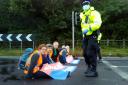 Protesters from Insulate Britain blocking a roundabout at Junction 3 (PA)