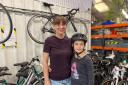 Kateryna Herych, 38, and her eight-year-old daughter Daniella Googe at The Bike Project's workshop in Deptford (photo: PA)