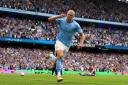 Erling Haaland celebrates scoring one of his three goals against Crystal Palace at the Etihad Stadium in August 2022