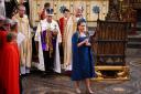 MP Penny Mordaunt commissioned an embroidered midi-length cape dress for her role in the coronation ceremony