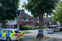 A police cordon in Wembley after a woman was stabbed to death in a residential property