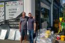 Kevin Bottomley and Will Buckle, the two man duo behind KJ Building Supplies, outside the shop (photo: Supplied by Save KJ Building Supplies campaign)