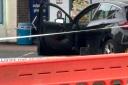 An apparent blood stain on a car door in a crime scene outside Lewisham Hospital
