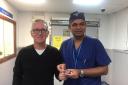 Robert Begent and Professor Dasgupta (holding a 3D model of Mr Begent's prostate)