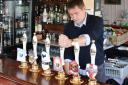 News Shopper's Andrew Parkes gets behind the bar at The George and Dragon in Swanscombe