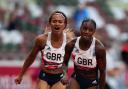 Imani-Lara Lansiquot, from Peckham, hands over to Dina Asher-Smith (PA)