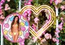 (Background) Love Island villa. (Circle) Afia Cülcüloğlu on on Love Island, tonight at 9pm on ITV2 and ITV Hub. Episodes are available the following morning on BritBox. Credit: ITV