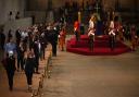 Members of the public pay their respects as the vigil begins around the coffin of Queen Elizabeth II in Westminster Hall, London, where it will lie in state ahead of her funeral on Monday