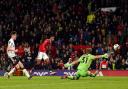 Marcus Rashford scores Manchester United's third. Picture: Martin Rickett/PA