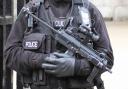 Armed police have broken into a house and arrested four men after a male was kidnapped in Bromley.